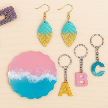 Set of earrings and keychains with colorful designs on a beige background